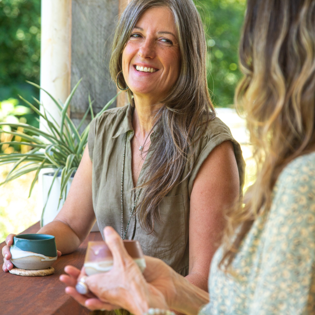 Two women sharing Cacao as a connecting ritual