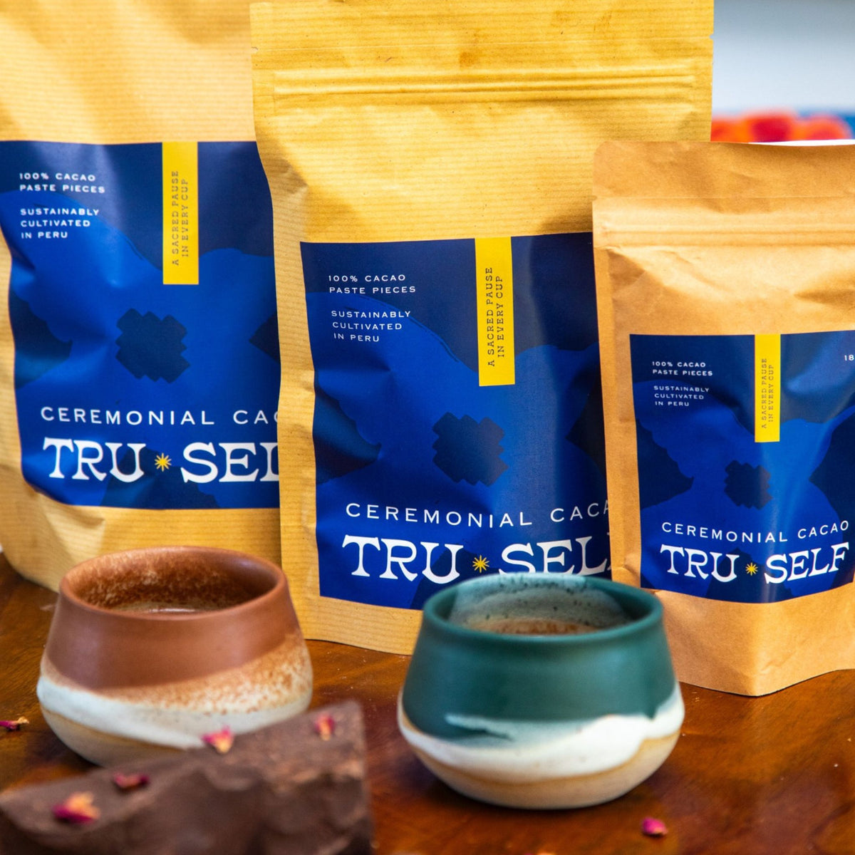 Prepared cup of TruSelf Ceremonial Cacao in ritual cup and 3 size packs